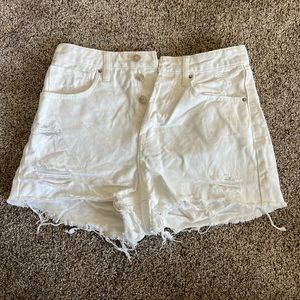 White denim shorts with rips